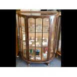 1930's Bow Front Display Cabinet, glass interior shelves, raised on ball feet, measures approx. 34''