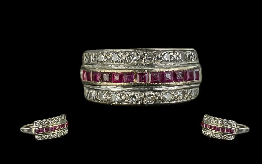 18ct Gold Ruby & Diamond Ring, a central row of calibre cut rubies between two rows of brilliant cut