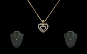 18ct Gold Double Heart Shaped Diamond Set Pendant - Attached to a 18ct Gold Chain. Both Pieces
