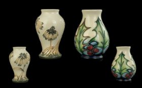Two Small Moorcroft Vases, 4'' high, A small Moorcroft 'Holly' vase designed by Philip Gibson, dated