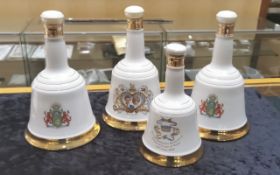 Four Bell's Scotch Whisky Commemorative Porcelain Decanters, three 75cl decanters celebrating the