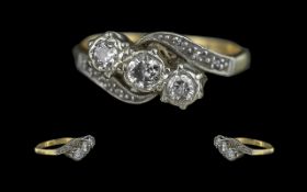 18ct Gold and Platinum 3 Stone Diamond Set Ring, With Diamond Set Shoulders. Marked 18ct and