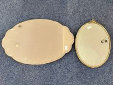 Two Vintage Wall Mirrors, one oval with bow top measures 20'' x 13'', and a larger oval mirror