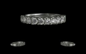 A Superb Platinum Diamond Set Band Ring, In a Prong Setting. Ring Size K. Marked Platinum 950 to