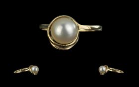 Ladies Attractive Fresh Water Pearl Ring in setting of 10ct gold; ring size J