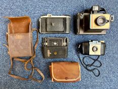 Four Vintage Cameras, comprising Kodak and Polaroid.