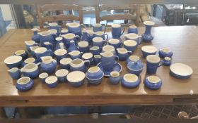 Quantity of Devon Blue Pottery, over 60 in total, comprising mugs, jugs, vases, vinegar jars, etc.