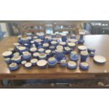 Quantity of Devon Blue Pottery, over 60 in total, comprising mugs, jugs, vases, vinegar jars, etc.