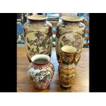 Two Tall Oriental Vases, hand painted Satsuma vases decorated with butterflies and flowers with gilt