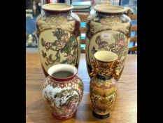 Two Tall Oriental Vases, hand painted Satsuma vases decorated with butterflies and flowers with gilt