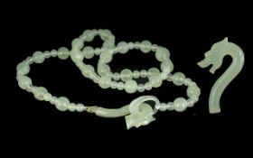 Celadon Jade Dragon Clasp Necklace, the necklace comprising two sizes of round jade beads, the