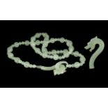 Celadon Jade Dragon Clasp Necklace, the necklace comprising two sizes of round jade beads, the