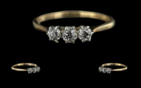 18ct Gold and Platinum 3 Stone Diamond Set Ring. Marked 18ct and Platinum to Shank. The 3 Faceted