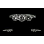 18ct White Gold and Platinum 3 Stone Diamond Set Ring. Marked 18ct and Platinum. The 3 Round