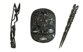 Tribal Art Interest. A Collection of Four Carved Wooden Items. To include a large face mask 22 by 18