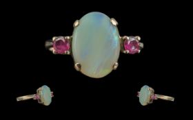 Ladies Pleasing 9ct Gold Opal & Garnet Set Ring - Full Hallmark To Shank. The Large Oval Shaped Opal