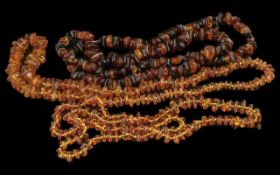 Three Long Baltic Amber Nugget Necklaces comprising one ochre and honey gold, 36 inches (90cms)