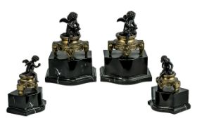 A Fine Pair of Impressive Bronze Decorating Cherub Figures Raised on Black Marble Bases ( Shaped )