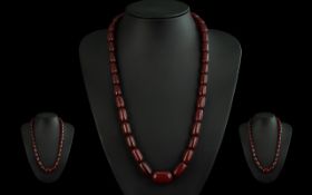 A Fine Quality Vintage Cherry Amber Graduated Beaded Necklace with Gold Bolt Ring. The Amber of