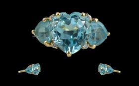 Ladies - 14ct Gold Attractive 3 Stone Aquamarine Set Dress Ring. The 3 Heart Shaped Aquamarines of