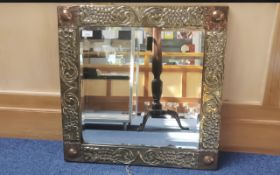 Early 20th Century Brass Arts &^ Crafts Framed Wall Mirror, with copper corner bosses. Square shape,