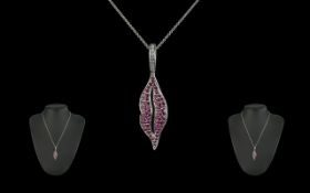 18ct White Gold - Attractive Ruby Set Styalished Pendant - Attached to a 18ct White Gold Necklace.