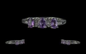 Ladies Amethyst and Diamond Set Ring In 9ct White Gold. Amethyst 3 Stone Ring with Diamond Spacers