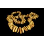 Long Yellow and Butterscotch Amber Necklace, a magnificent necklace of large, graduated nuggets of
