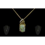 A Superb 18ct Gold Diamond and Opal Set Pendant, The Large Oval Shaped Opal of Excellent Multi-