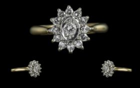 18ct Gold Attractive Diamond Set Cluster Ring, Flower head Setting. Marked 750 to Shank. The Round