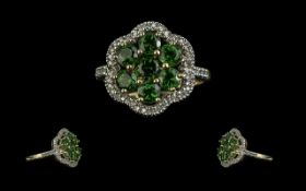 Ladies Green Tourmaline and Diamond Ring in 9ct gold, the green tourmalines surrounded by the