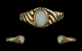 Attractive Opal Set Ring in a 9ct gold, twist style band; the opal of good colour, the band fully