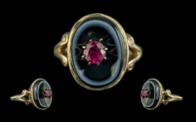 Antique Period 18ct Ruby on Black Enamel Mourning Ring. The Central Faceted Ruby of Good Colour.