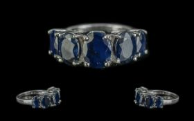 Sapphire Five Stone Ring, five oval cut sapphires, totalling 7.5cts, set in a band style, graduating