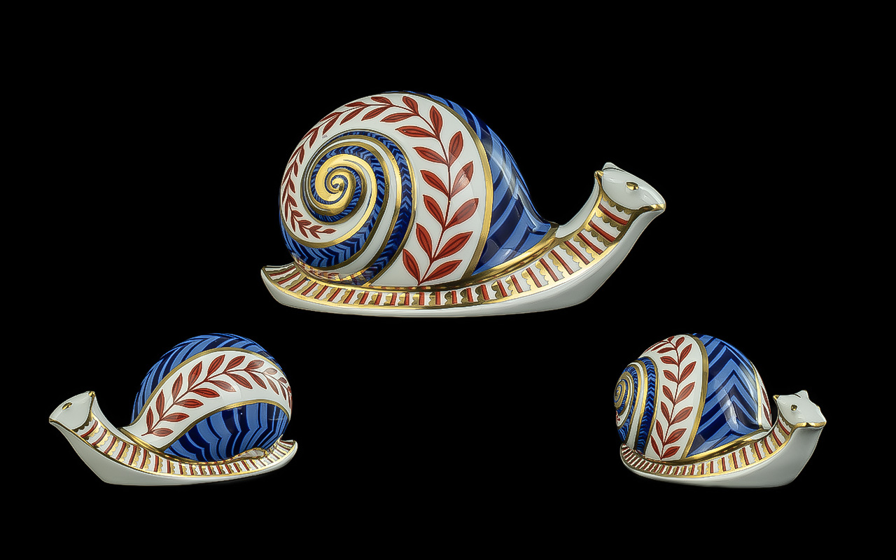 Royal Crown Derby Paperweight in the form of a Snail. With gold stopper. In good condition. Length