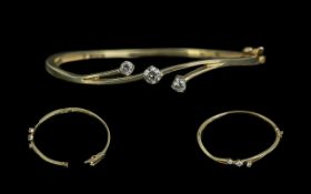 14ct Yellow Gold - Attractive and Contemporary 3 Stone Diamond Set Hinged Bangle.