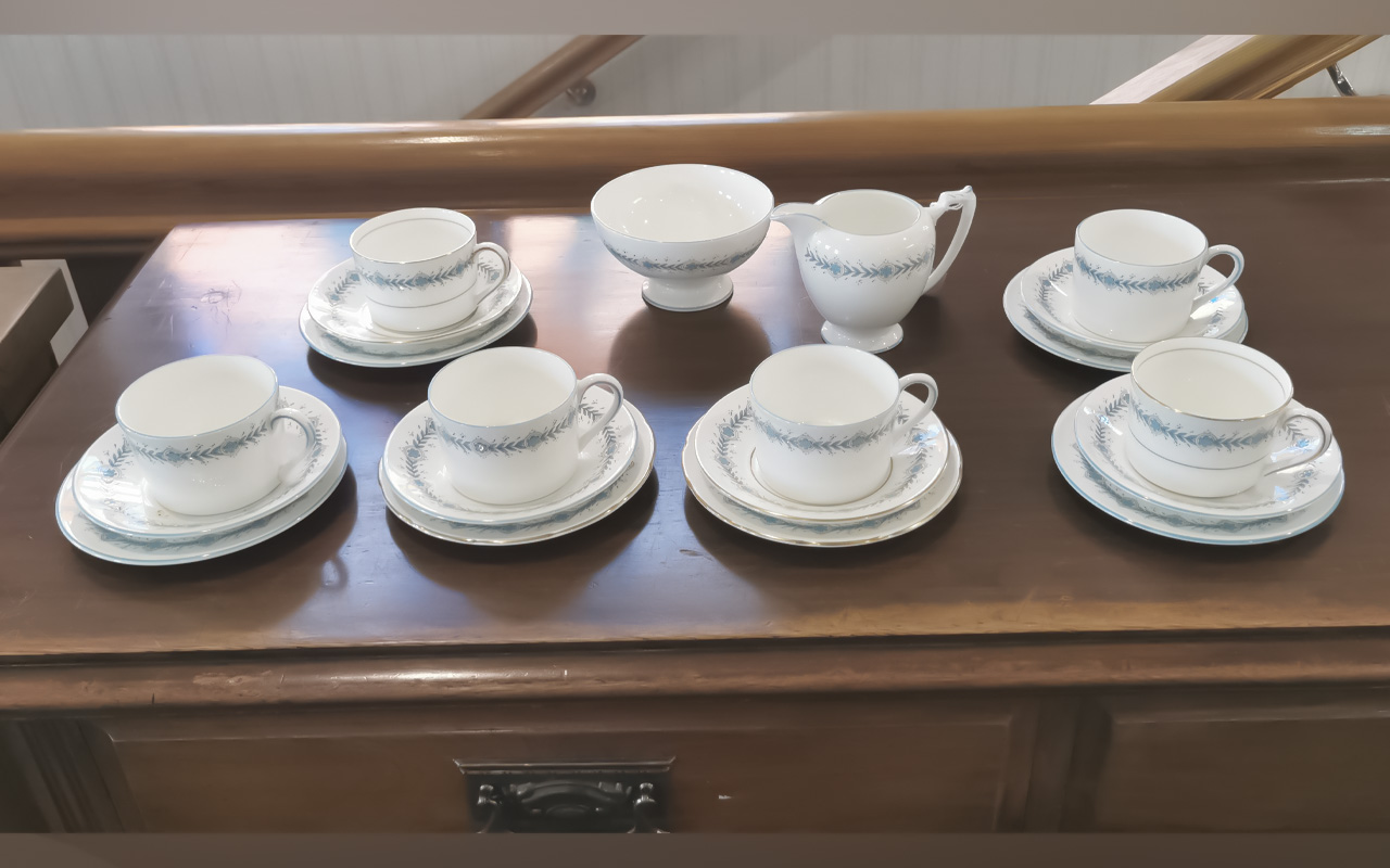 Coalport Tea Service, comprising six cups, saucers and side plates, a milk jug and sugar bowl.