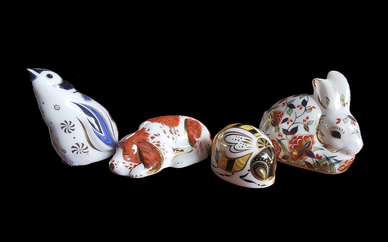 Four Royal Crown Derby Paperweights, comprising Meadow Rabbit, Puppy, Snowflake Penguin,