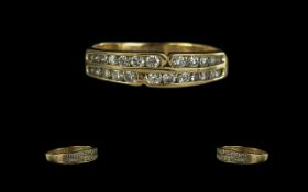 18ct Yellow Gold - Pleasing Quality Double Channel Diamond Set Dress Ring. The Brilliant Cut Round