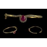 A Fine Quality - Attractive 9ct Gold Ruby and Diamond Set Hinged Bangle. Marked 9ct.