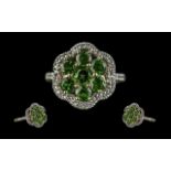 Ladies Green Tourmaline and Diamond Ring in 9ct gold, the green tourmalines surrounded by the
