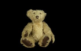 Light Golden Brown Teddy Bear, possibly 1950s Steiff, with a distinctive head shape and brown
