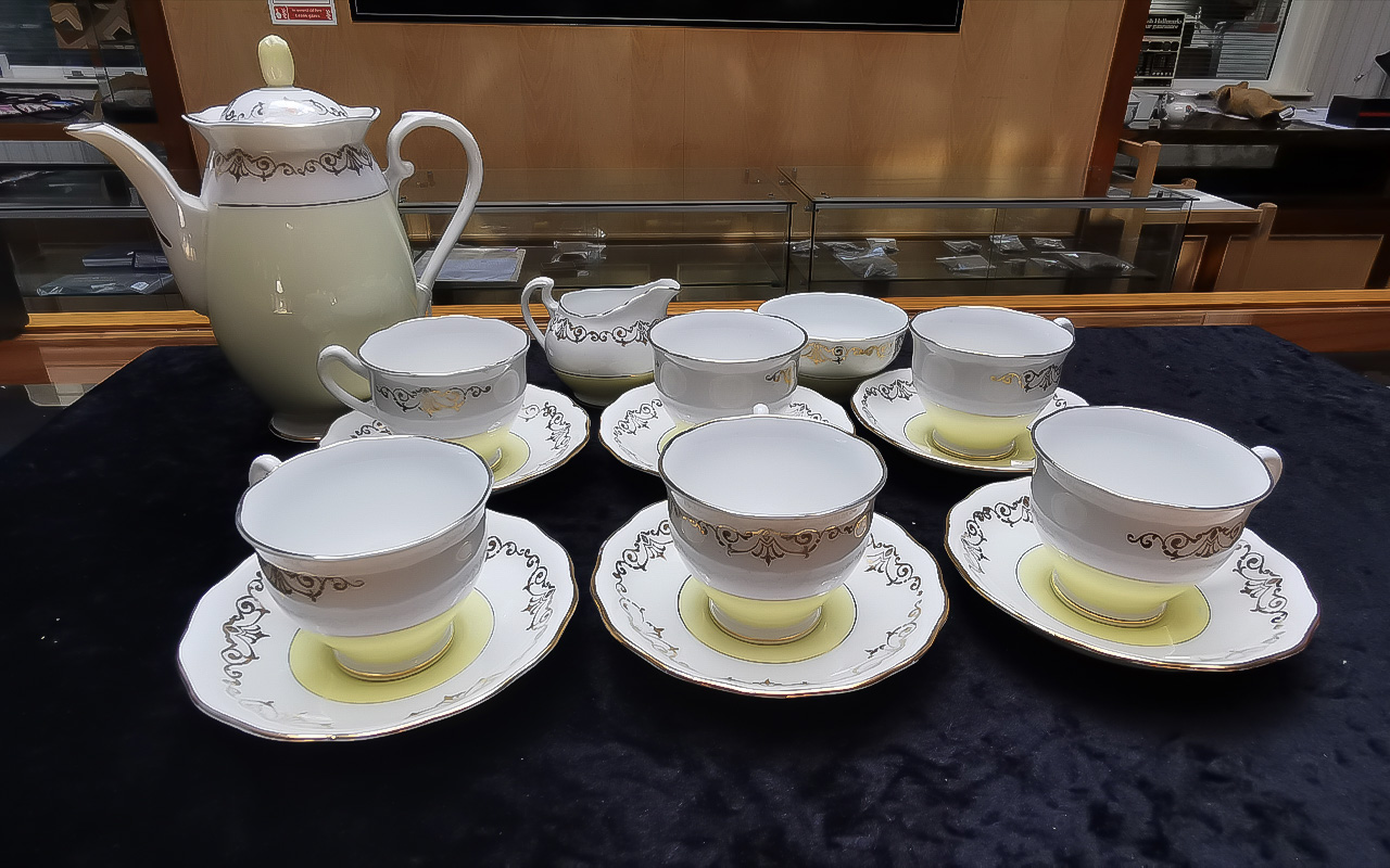 Fine English Bone China Tea Set, lemon and white base with 22ct gold decoration,