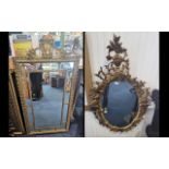 Two Decorative Mirrors, one an oval Rococo design gilt framed mirror, measures approx.