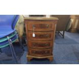 Mahogany Four Drawer Chest, curved bow front, brass handles, raised on four feet.