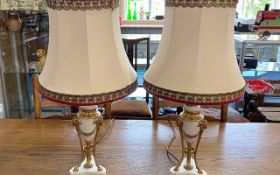 Pair of Decorative Table Lamps, spelter cream base with gilt trim and rams head decoration.