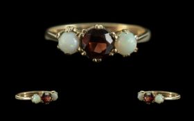 Antique Period - Pleasing 9ct Gold 3 Stone Garnet & Opal Set Ring, full hallmark to shank.