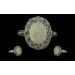 18ct Gold - Attractive Opal and Diamond Set Ring, Flower head Setting. Full Hallmark for 18ct. The