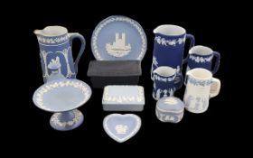 Collection of Wedgwood, comprising three matching Wedgwood Jasper dark blue jugs measuring 7.