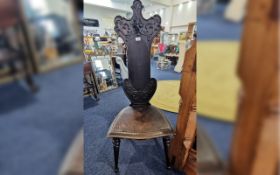 Early 20th Century Carved Oak Hall Chair, shaped shield back, turned supports, height 50",